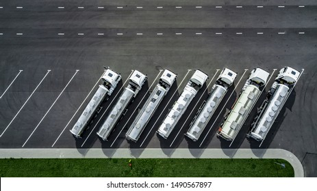 trucks stand in a row in the Parking lot top view. logistics centre.