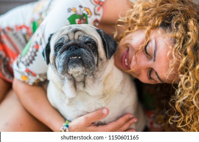 True Love Between Beautiful Caucasian Woman And Old Dog Pug, Odd Friends And Family Alternative Concept. Cheerful Lady And Smile Domestic Animal. Portraits