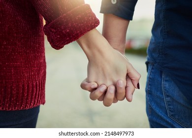 True Love Means Never Letting Go. Cropped Shot Of A Couple Holding Hands Outdoors.