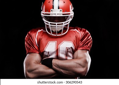 True man. Portrait of strong sturdy rugby player folding his hands and expressing fortitude and nerve while standing isolated on black background. - Shutterstock ID 306290543