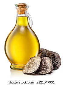 Truffle oil and black edible winter truffle on white background.