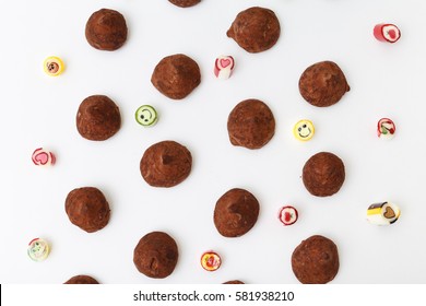 Truffles pattern, top view flat lay of various chocolate pralines candy on white background. Chocolate Candy, Truffle.