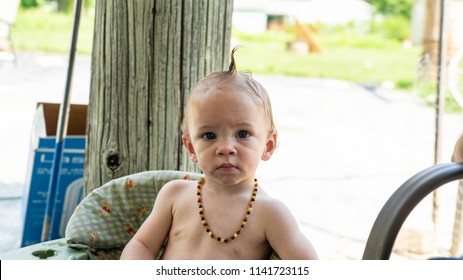 Trumbull County, Ohio/USA - July 4, 2018: Young Baby Boy With Funny Hair