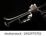 Trumpet player hands playing brass instrument. Jazz classical orchestra music