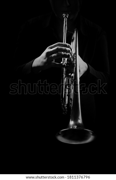 Trumpet player hands playing jazz\
music instrument close up. Brass orchestra\
instruments
