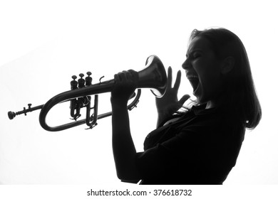 trumpet and a woman - beautiful young woman - shadows - valves and tubes