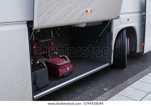The trunk of\
the bus, loaded cargo,\
suitcases.