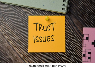 Trust Issues Write On Sticky Notes Isolated On Office Desk.