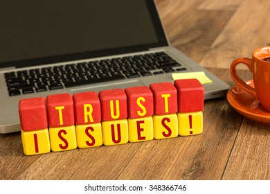 Trust Issues Written On A Wooden Cube In A Office Desk