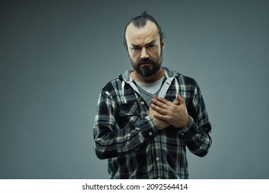 Trust Me - I Mean What I Say With All My Heart, A Conceptual Image Of A Sincere Genuine Man Staring At The Camera With An Earnest Expression And His Hands Crossed Over His Heart