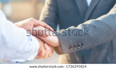 Trust Promise Concept. Honest Lawyer Partner with Professional Team make Law Business Agreement after Complete Deal. Ethics Business people handshake, touch and Respect customer to trust partnership.