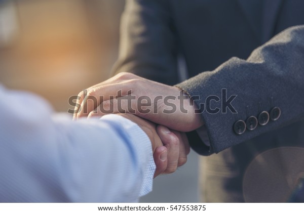 Trust Promise Concept. Honest Lawyer Partner\
with Professional Team make Law Business Agreement after Complete\
Deal. Ethics Business people handshake, touch and Respect customer\
to trust partnership.