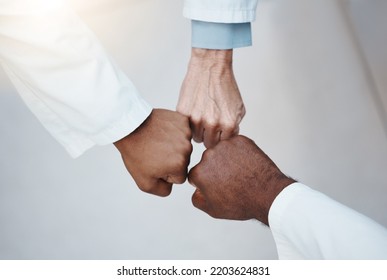 Trust, Teamwork And Hand Fist Together In Solidarity With Medical Ethics In The Workplace. Support Of Diverse Professional Healthcare Work People In Organization With Respect And Loyalty.