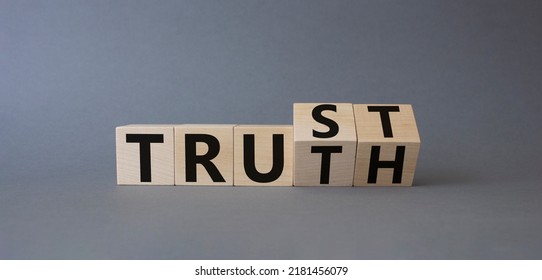 Trust And Truth Symbol. Turned Cubes With Words Truth And Trust. Beautiful Grey Background. Business And Trust And Truth Concept. Copy Space