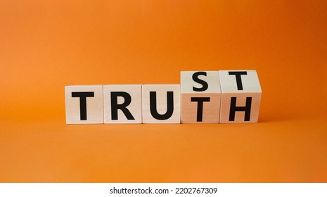 Trust And Truth Symbol. Turned Cubes With Words Truth And Trust. Beautiful Orange Background. Business And Trust And Truth Concept. Copy Space