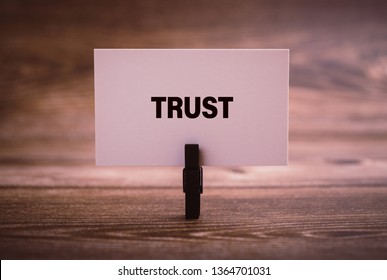 Trust word written in the paper with office