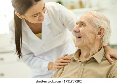 Trusted medical personnel acting supportive towards senior patient - Shutterstock ID 1931939282