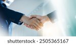 Trusted partner. Businessmen making handshake with partner, greeting, dealing, merger and acquisition, business cooperation concept, joint venture, Build trust in business and finance relationships.