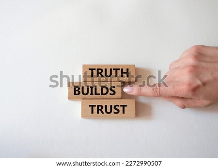Truth builds trust symbol. Concept word Truth builds trust on wooden blocks. Businessman hand. Beautiful white background. Business and Truth builds trust concept. Copy space