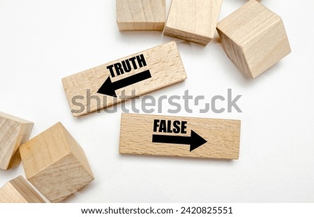TRUTH FALSE on wooden blocks on white background