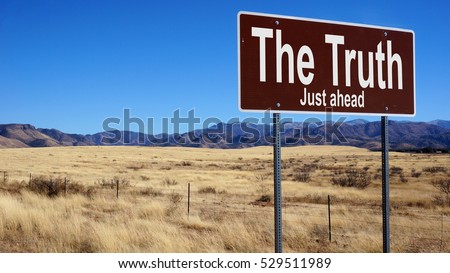 The Truth road sign with blue sky and wilderness