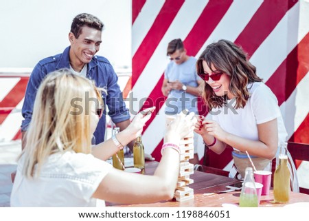 Similar – Mann öffnet Bierflasche am Sommergrill