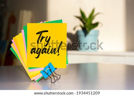 Try Again write on Sticky Notes.