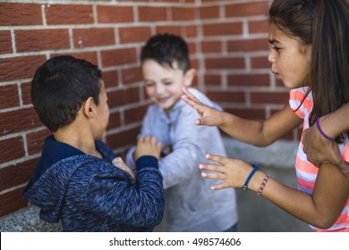 try Stopping Two Boys Fighting In Playground