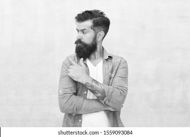 Try This. Barbershop Hair Care And Health. Male Casual Style. Fashion Model. Serious Bearded Man. Mature Hipster With Beard. Anti Dandruff Barber Care. Brutal Caucasian Hipster. Say No To Dandruff.