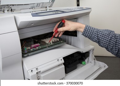 Trying To Repair The Office Printer At A Bright Business Place