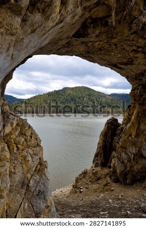 Tsar's Gate stone arch on the shore of the Krasnoyarsk Reservoir. Yenisei river. Krasnoyarsk Krai, Siberia. Russia