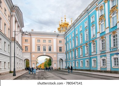 TSARSKOYE SELO, SAINT-PETERSBURG, RUSSIA - OCTOBER 7, 2017: People on the yard of the Imperial Lyceum (left). On the background is the arch between The Lyceum and The Catherine Palace Church Wing