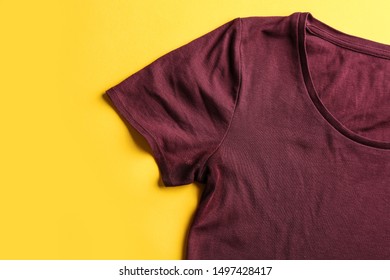 T-shirt with deodorant stain on yellow background, top view - Shutterstock ID 1497428417