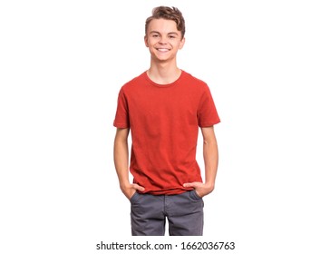 T-shirt Design Concept. Teen Boy In Blank Red T-shirt, Isolated On White Background. Mock Up Template For Print. Happy Child With Hands In Pockets, Looking At Camera, Front View.