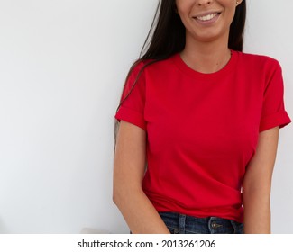 Tshirt Mockup, Front View Of Unrecognizable Woman Wearing Red Tshirt. Copy Space On Empty Area On Her T-shirt For Design Or Inscription. Fashion Lifestyle Mock Up Of Red Tshirt. T-shirt Template.