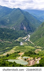 Tskhenistsqali River Valley Landscape In Racha Region Of Georgia With Svaneti Mountain Range, Lush Green Forests And Vineyards Seen From To Khvamli Mountain.