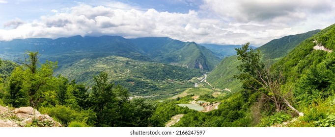 Tskhenistsqali River Valley Panorama In Racha Region Of Georgia With Svaneti Mountain Range, Lush Green Forests And Vineyards Seen From To Khvamli Mountain.