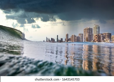 Tsunami king tide, dark stormy sky and rain approach the buildings of Surfers paradise, Gold Coast, Australia. Tsunami, King Tide or Cyclone concept