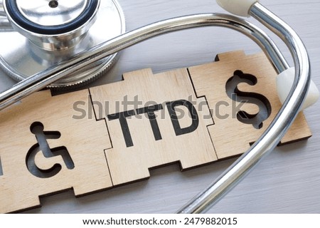 TTD Temporary total disability abstract. Puzzle pieces and a stethoscope.