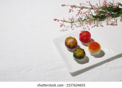 tteok, Korean traditional snack, rice cake, jeolpyeon, mochi, dessert, colorful rice snack with white background 