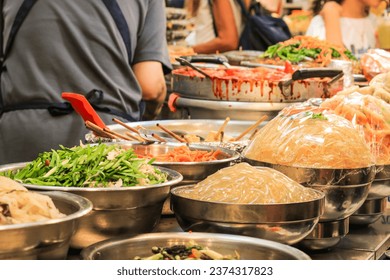 Tteokbokki, kimbap, japchae, famous street food closeup at Gwangjang Market, one of the most popular places for Korean street food in Seoul. - Powered by Shutterstock