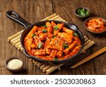 Tteokbokki is a Korean dish of rice flour cooked in spicy and sweet gochujang seasoning.