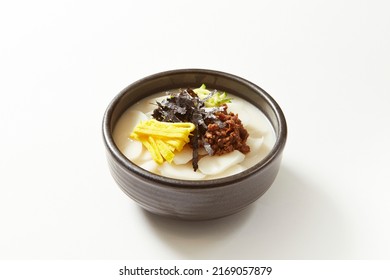  tteokguk, rice-cake soup (prepared with slices of rice cake, beef, eggs, etc.) - Shutterstock ID 2169057879