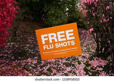 Tualatin, OR, USA - Oct 22, 2019: Free Flu Shots Advertising Is Seen During Flu Season Outside A Fred Meyer Hypermarket In Tualatin.