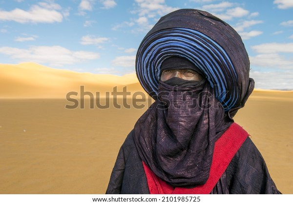 Tuareg Man wearing Tuareg outfit in Libyan desert\
near of ghat city in\
libya