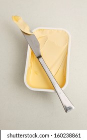 A Tub Of Butter On A Kitchen Bench