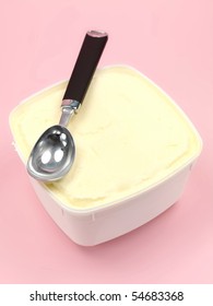 A tub of vanilla icecream isolated against a pink background