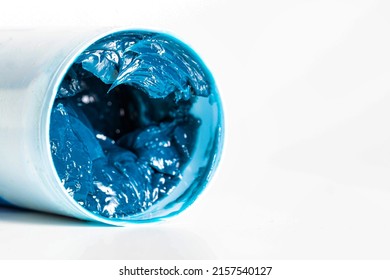 Tube With Blue Automotive High Temperature Grease On A White Background, Isolate. Copy Space For Text