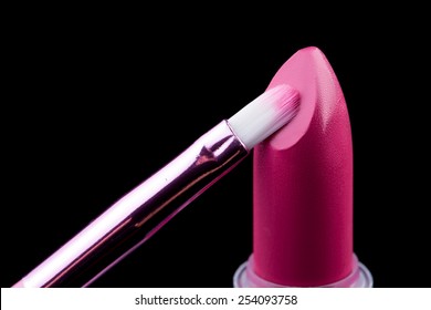 Tube Of Lipstick With A Brush Make-up On Black 