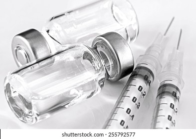 Tuberculin Syringe and Sterile Vial Filled with Medication Solution. An Injection Pharmaceutical Dosage Form.